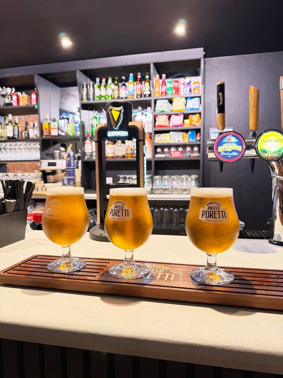 Three glasses of lager on the refurbished bar