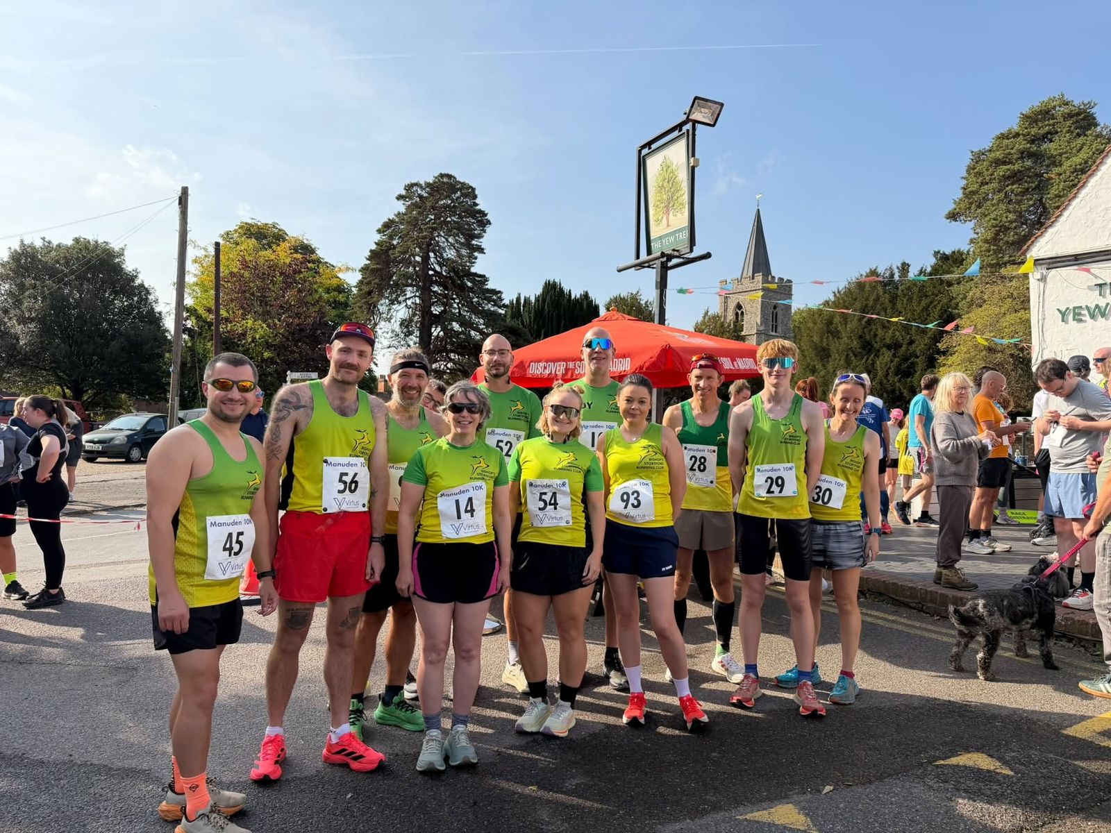 Club runners in green and gold vests at the Manuden Fun Run
